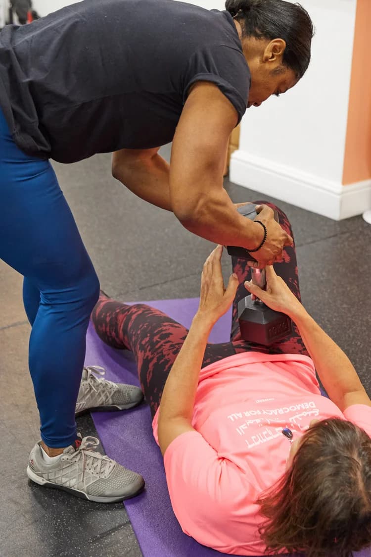 Mat-based barre coaching at AW Wellness Studios